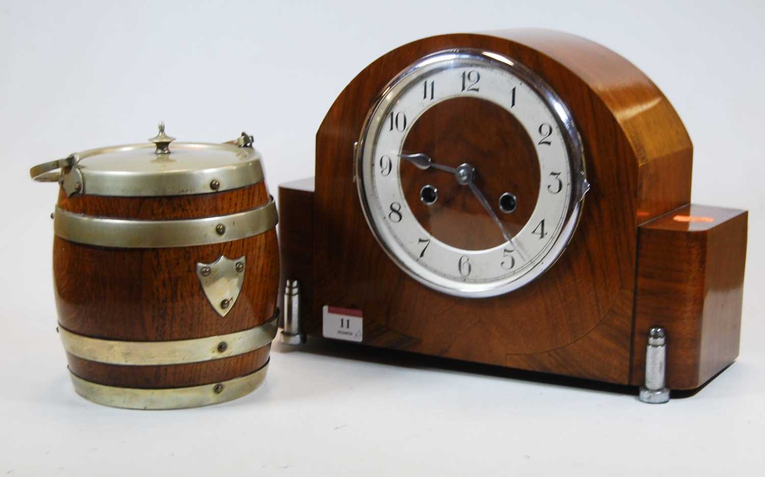 Lot 11 - A 1930s walnut cased mantel clock the silvered...