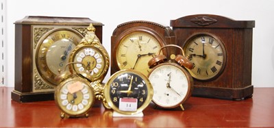 Lot 14 - An early 20th century oak cased mantel clock...