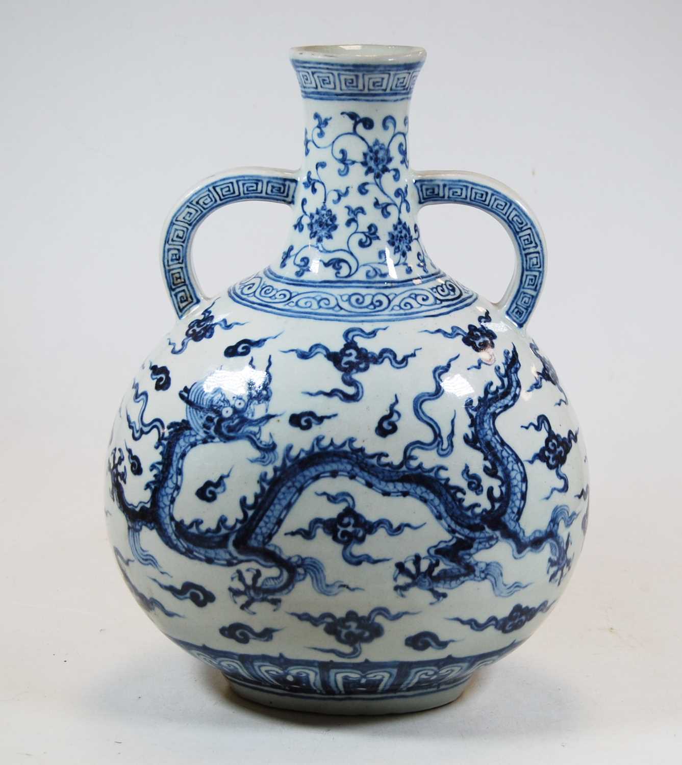 Lot 19 - A Chinese export blue & white vase, with twin...