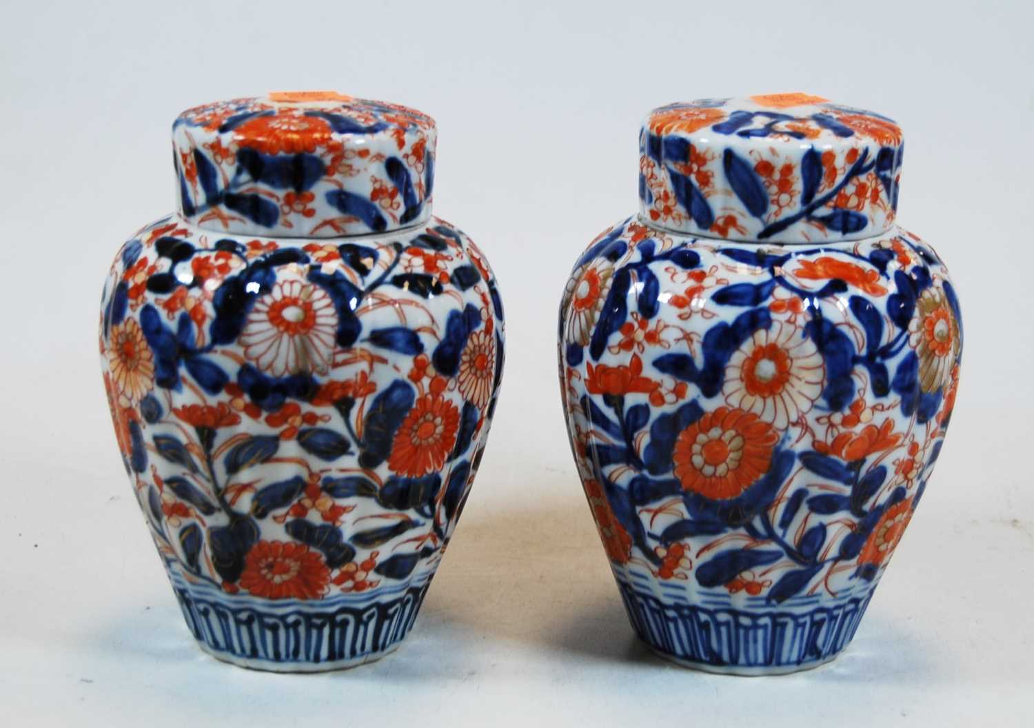 Lot 21 - A pair of Chinese imari palette jars and...