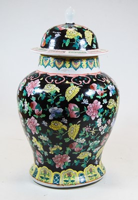 Lot 40 - A Chinese export famille noir jar and cover of...