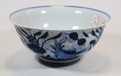 Lot 228 - A Chinese export blue and white bowl,...