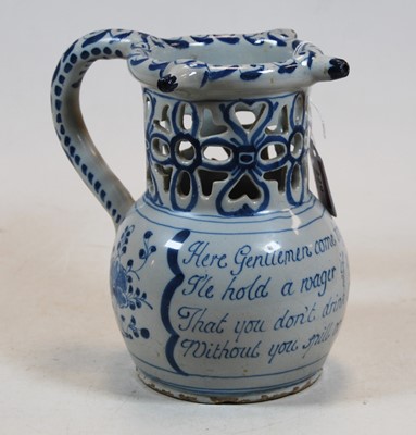 Lot 229 - An 18th century English Delft puzzle jug,...