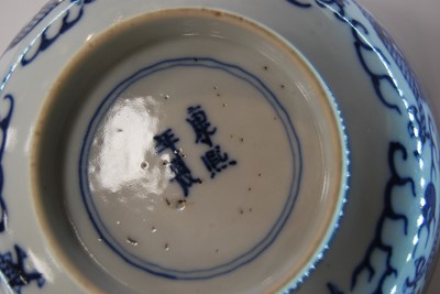 Lot 239 - A Chinese export blue and white dragon bowl,...