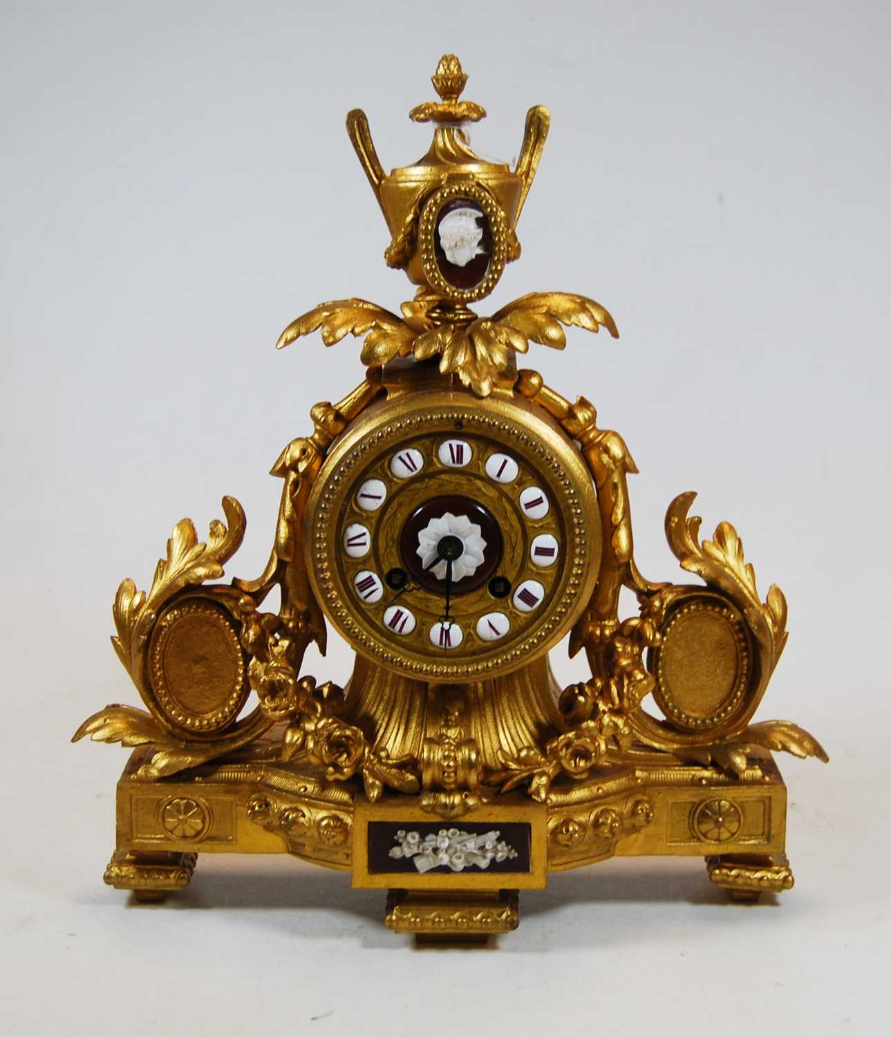 Lot 61 - A 19th century French gilt metal mantel clock,...