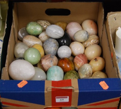 Lot 69 - A box of mixed polished hard stone eggs