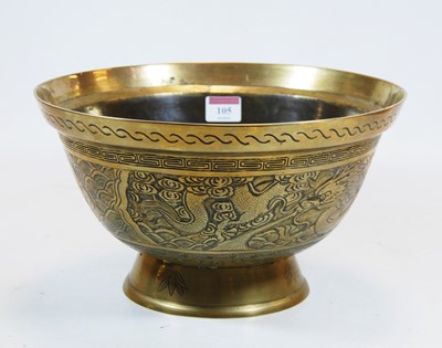 Lot 105 - A Chinese brass bowl, decorated with a dragon...
