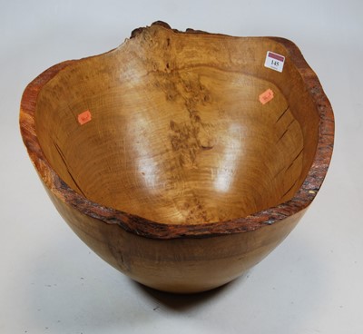 Lot 145 - A large rustic carved oak fruit bowl, dia. 40cm