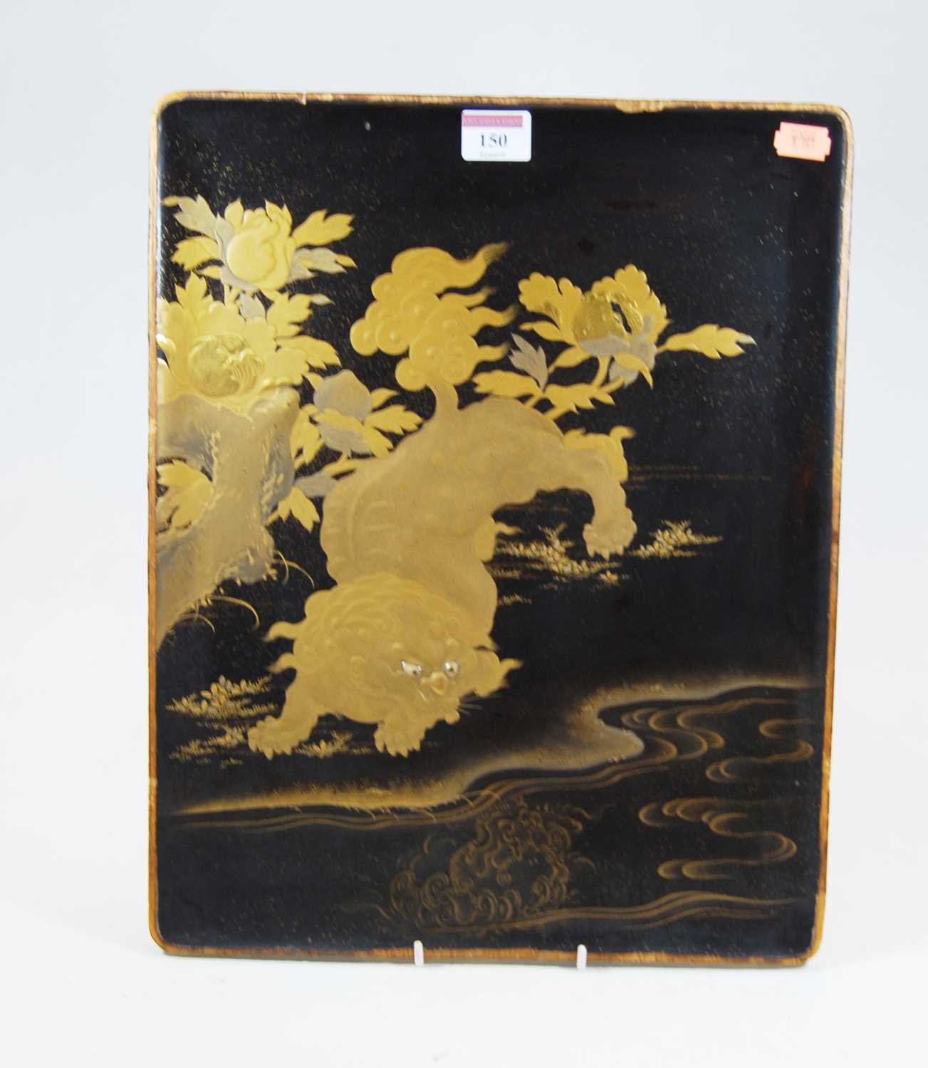 Lot 150 - A Chinese black lacquered panel, decorated in...