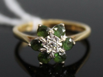 Lot 380 - A modern 18ct gold emerald and diamond...