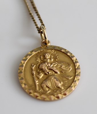Lot 365 - A 9ct gold St Christopher pendant on 9ct gold...