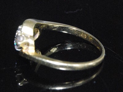 Lot 2594 - An 18ct yellow gold diamond crossover style...