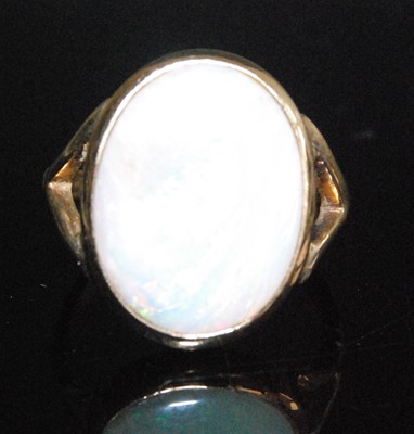 Lot 2551 - A 9ct yellow gold opal dress ring, comprising...