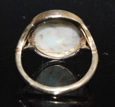 Lot 2551 - A 9ct yellow gold opal dress ring, comprising...