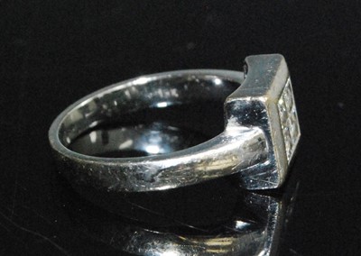Lot 2595 - A white metal diamond quatrefoil cluster ring,...