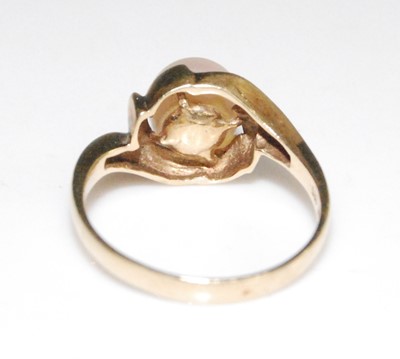 Lot 2621 - A yellow metal crossover style ring with a...
