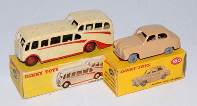 Lot 1990 - A Dinky Toys boxed public transport and saloon...