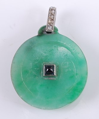 Lot 2563 - An Art Deco jade disc pendant, incised to...