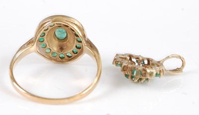 Lot 2564 - A 9ct gold emerald set dress ring, arranged as...