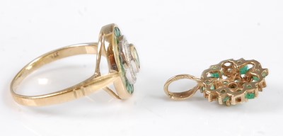 Lot 2564 - A 9ct gold emerald set dress ring, arranged as...
