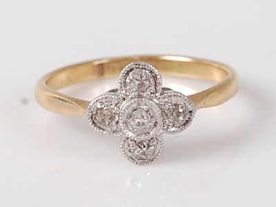 Lot 2672 - An Art Deco 18ct gold diamond flower head ring,...