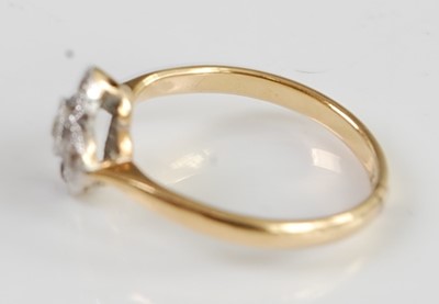 Lot 2672 - An Art Deco 18ct gold diamond flower head ring,...