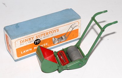 Lot 2011 - A Dinky Toys No. 751 lawnmower comprising red...