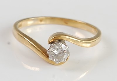 Lot 2691 - An 18ct gold diamond solitaire ring, the claw...