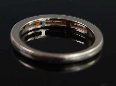 Lot 2692 - A platinum diamond half eternity ring,...