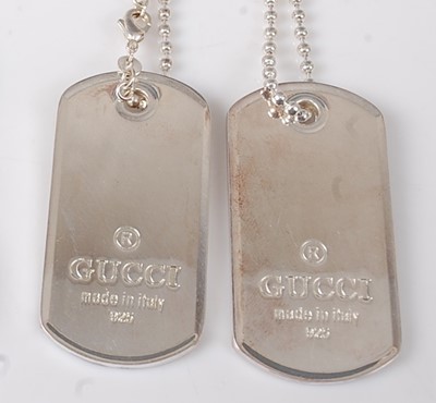 Lot 2733 - A pair of Gucci silver dog tags on single...