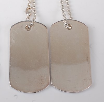 Lot 2733 - A pair of Gucci silver dog tags on single...