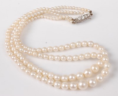 Lot 2742 - A cultured pearl double strand choker, the...