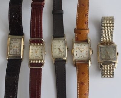 Lot 392 - Five various gents vintage gold plated tank...