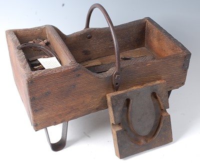 Lot 346 - * A 19th century pine and wrought iron farrier'...