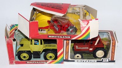 Lot 1307 - A Britains boxed tractor and farm implement...