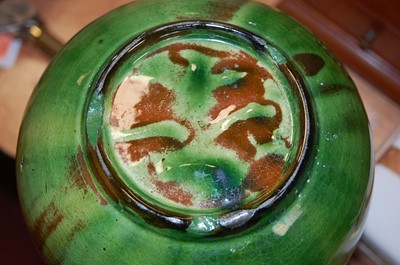 Lot 4 - A 20th century green glazed pottery urn...