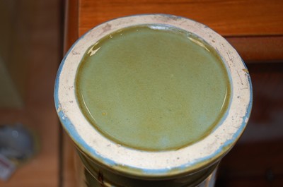 Lot 4 - A 20th century green glazed pottery urn...