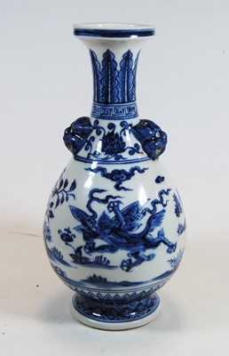 Lot 9 - A Chinese export blue & white glazed baluster...