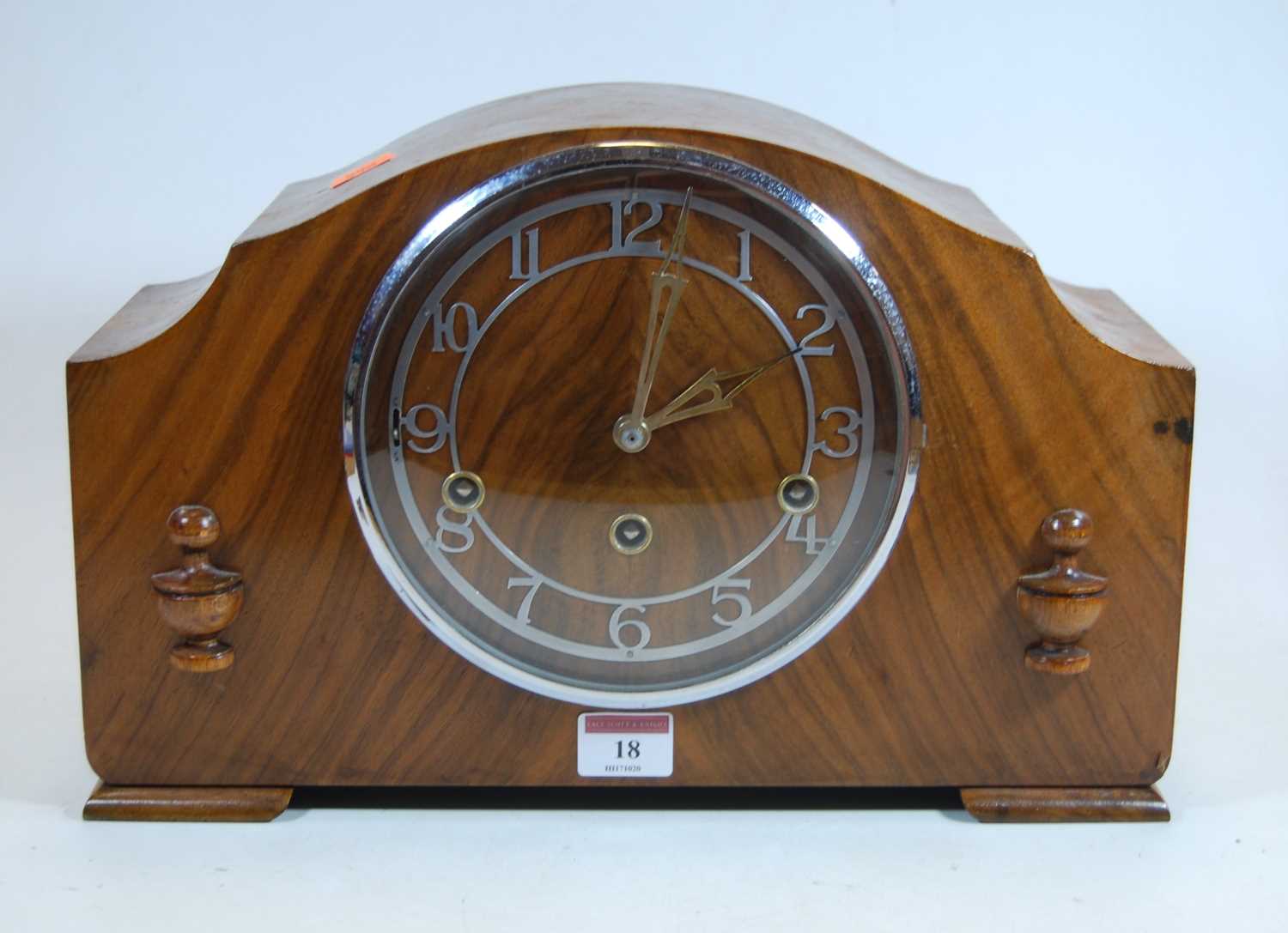Lot 18 - A 1930s walnut cased mantel clock, the chapter...