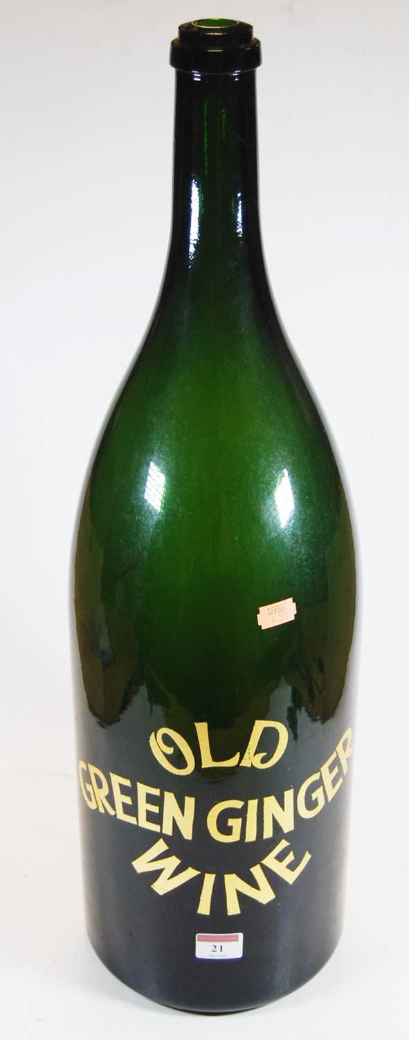 Lot 21 - An oversized green glass bottle, inscribed Old...