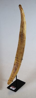 Lot 39 - A carved bone decorated with scrolls and...