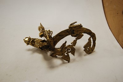 Lot 40 - A Chinese brass candlestick, in the form of a...