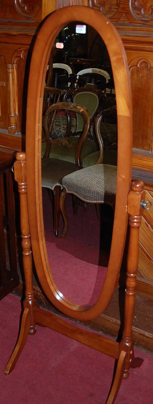 Lot 1120 - A contemporary beech oval cheval mirror