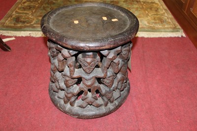 Lot 1238 - An African tribal stained hardwood circular...