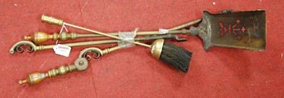 Lot 153 - A set of brass fire tools