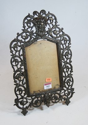 Lot 162 - A pierced brass photograph frame decorated...
