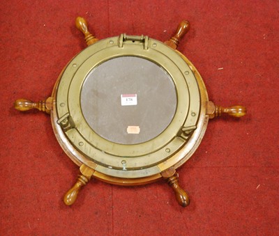 Lot 178 - A wall mirror in the form of a ship's porthole...
