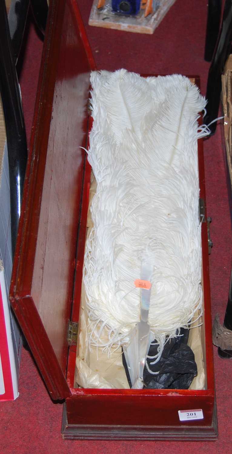 Lot 201 - A large ostrich feather fan with mother of...