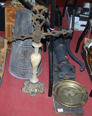 Lot 203 - A cast iron hand pump mounted on a board...