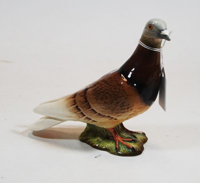 Lot 228 - A Beswick figure of a pigeon, model No. 1383...
